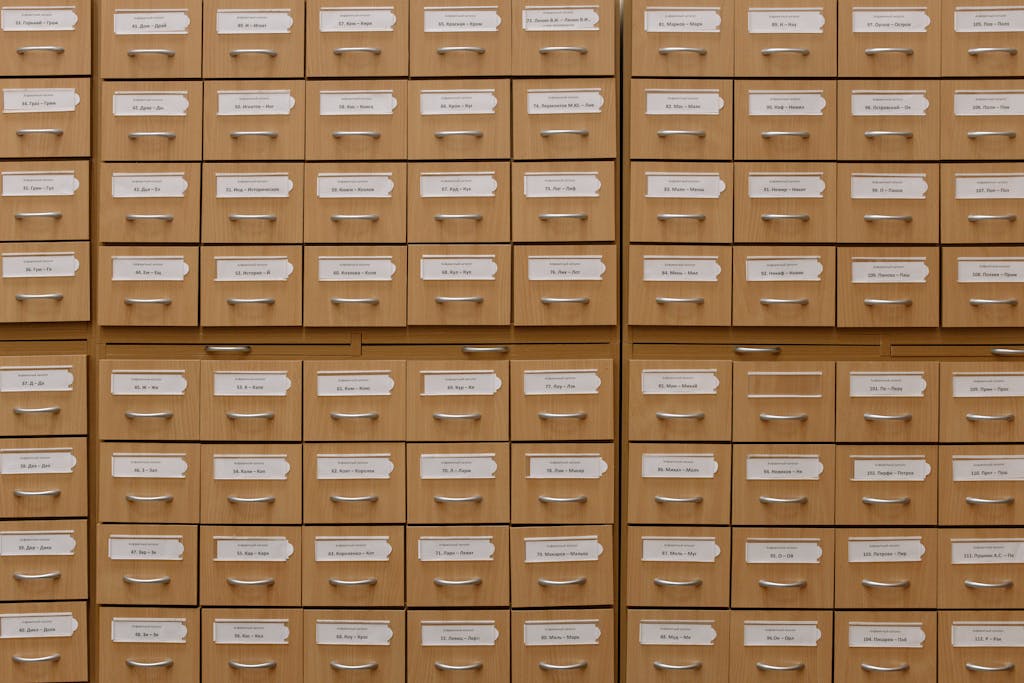 Close-up of labeled wooden storage drawers, perfect for organization concepts.