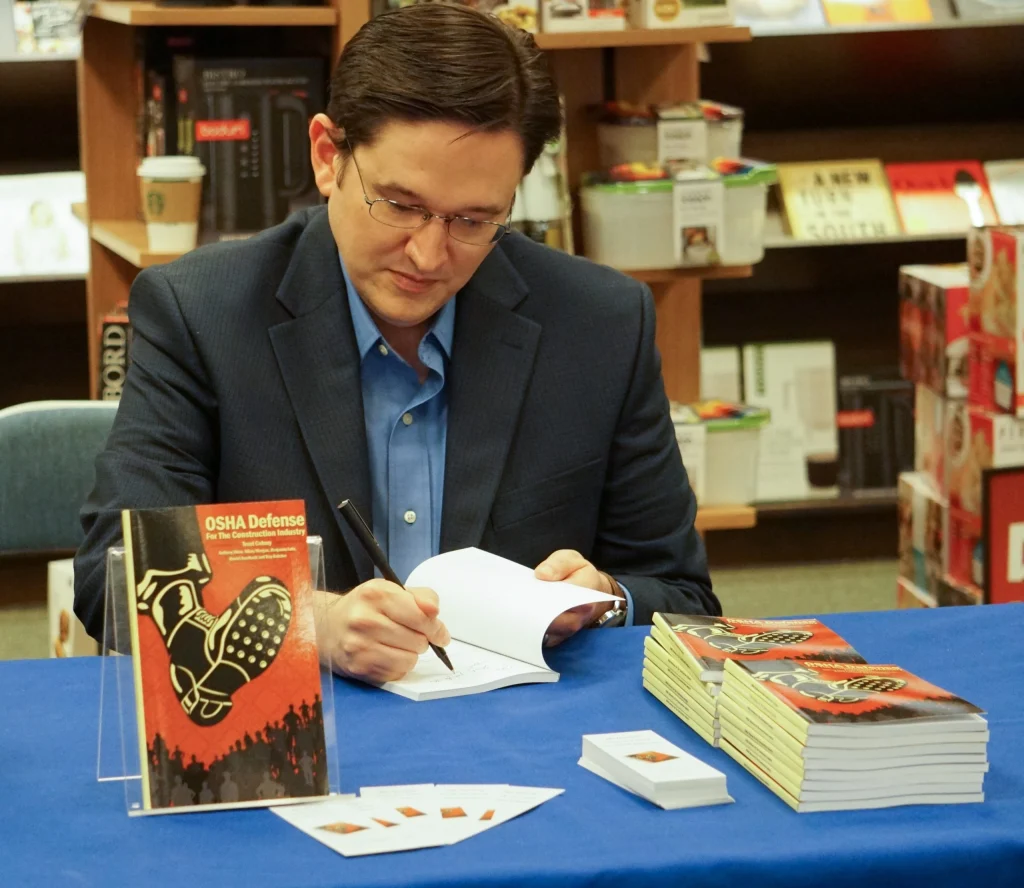 Trent Cotney signing books