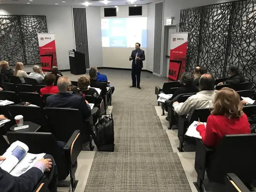 Trent Cotney speaking at an event.